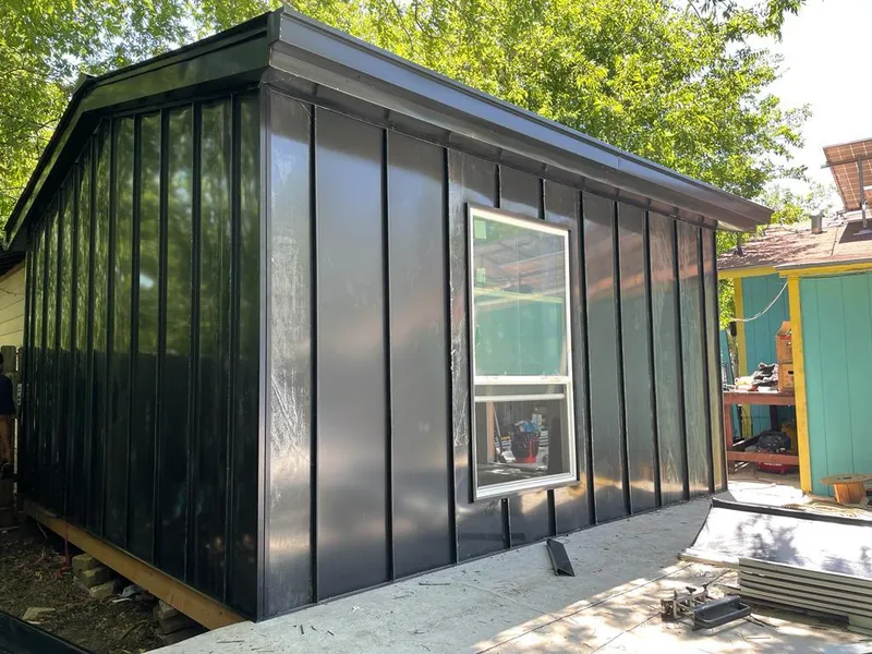 Black standing seam metal wall panels for Roof Inspection in Avon